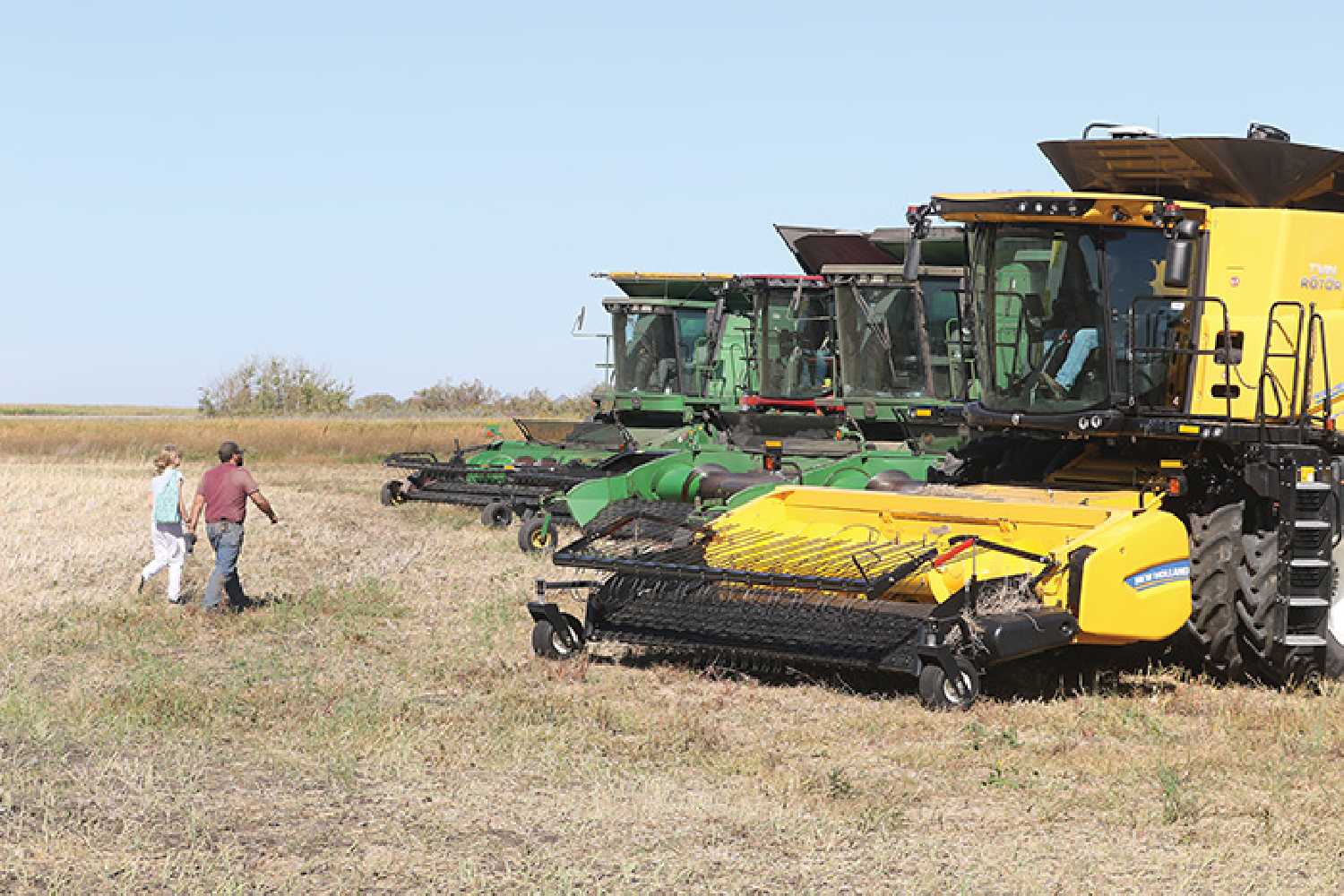 People heading to their combines to help take off the crop during the Harvest of Hope last week.